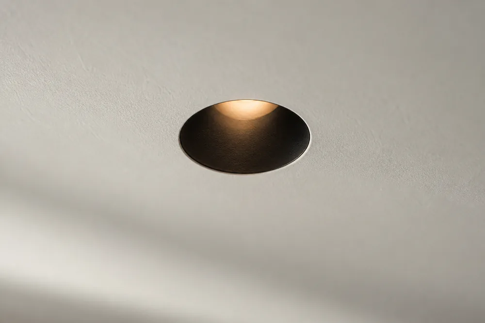 Illustrative ceiling: a flush plaster plane broken only by trimless apertures